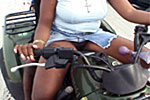 Black riding ATV with no panties on