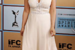 Rosie Perez in beige dress